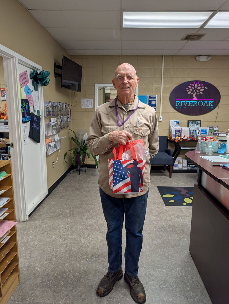 welding student with gift bag in student services