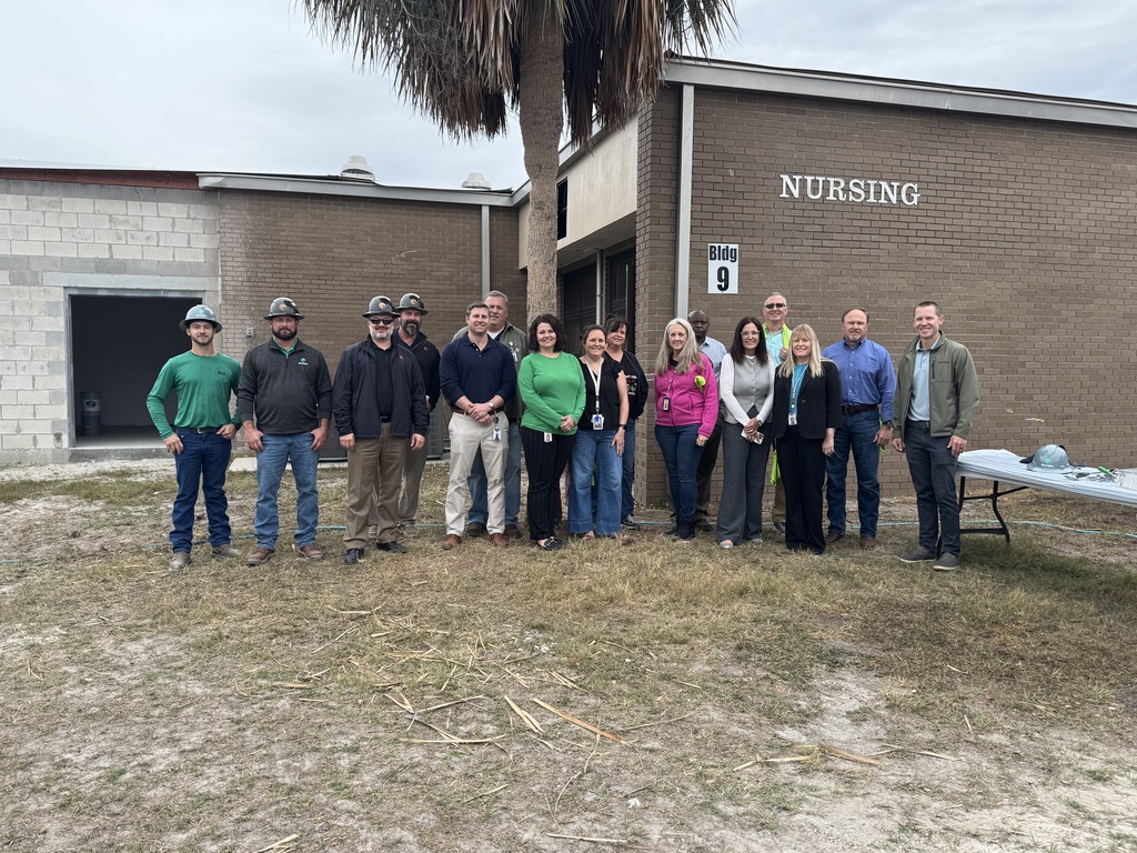 Group photo of Scorpio employees with RIVEROAK and Suwannee County School District employees