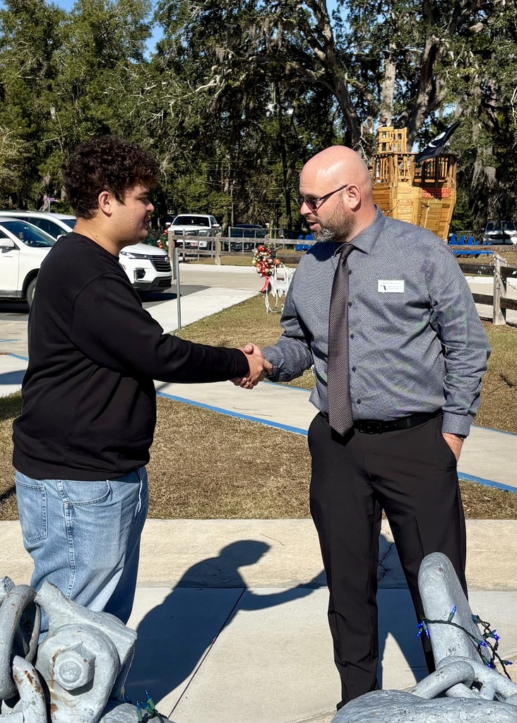Mark Harrison shaking Jon Weisner's hand
