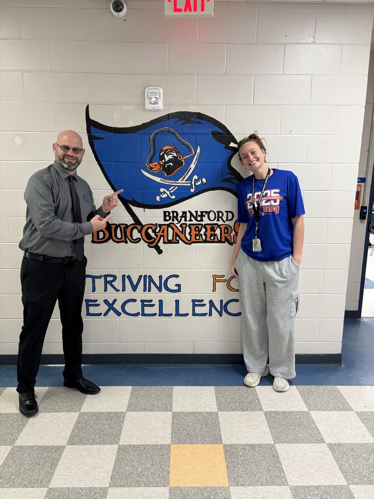 Mark Harrison posing with BHS staff member