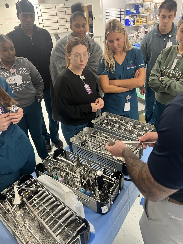 Surgical Technology students looking at instruments