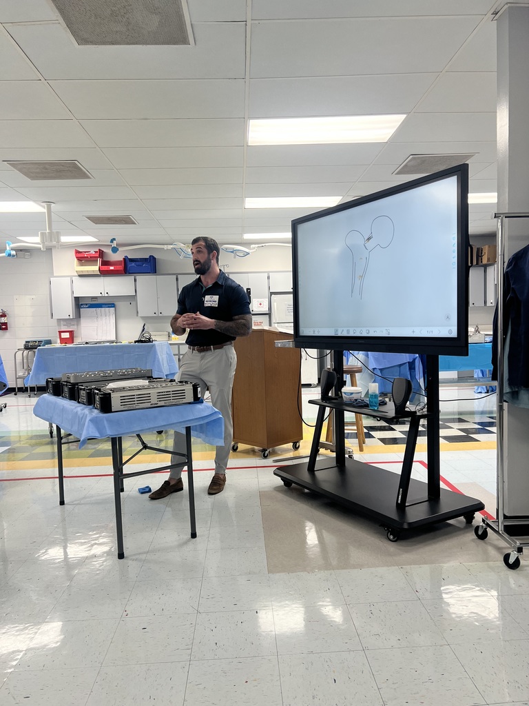 Jacob Brown showing students instruments
