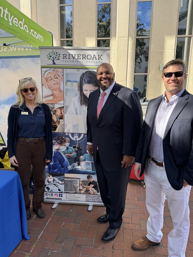 Clay Tomlinson and Julie Ulmer pictured with Senator Corey Simon
