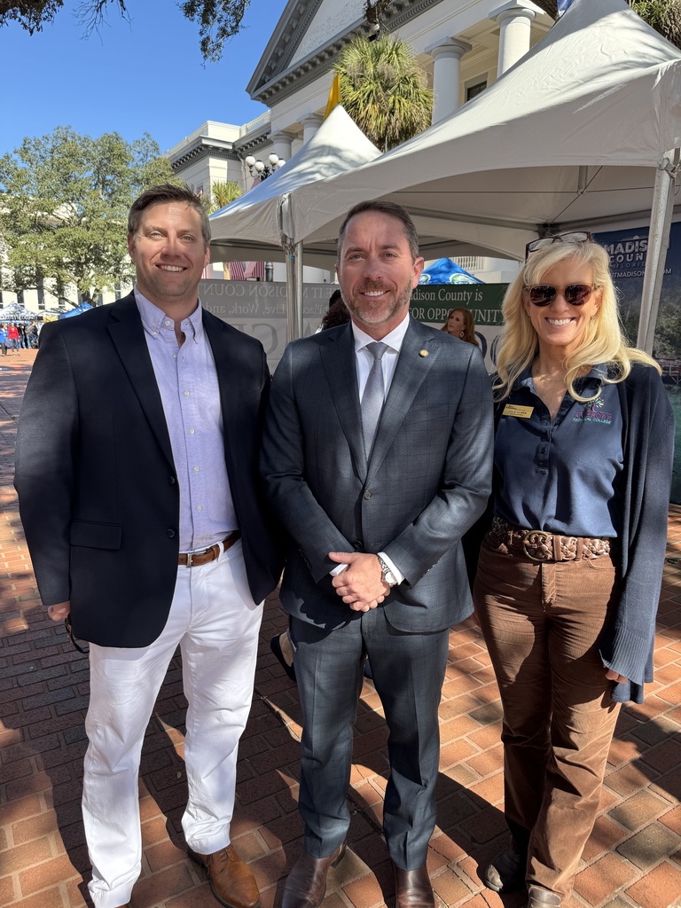Clay Tomlinson and Julie Ulmer pictured with Representative Jason Shoaf