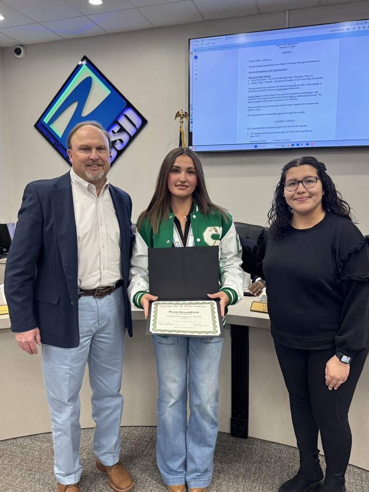 Superintendent Gray pictured with Ryan Donaldson and her golf coach