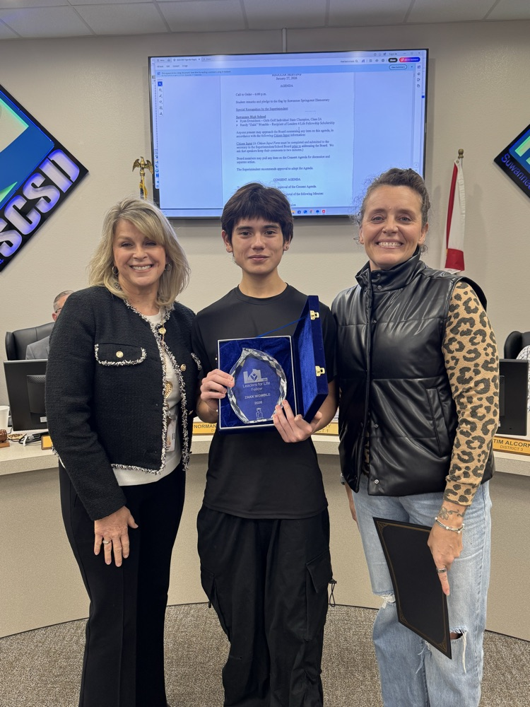 Zakk Wimbledon smiles with his mentors