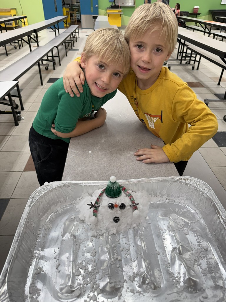 Students building snowmen at the Blizzard of Brilliance Event