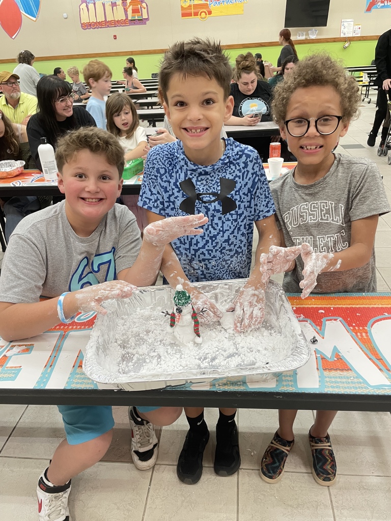 Students building snowmen at the Blizzard of Brilliance Event
