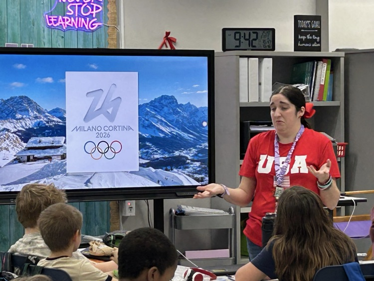 ms. Hewitt in front of students