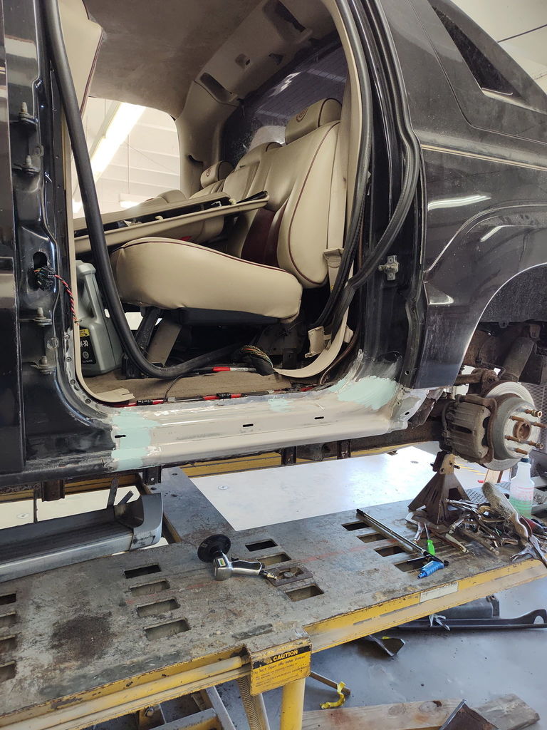 Rust repair on Cadillac