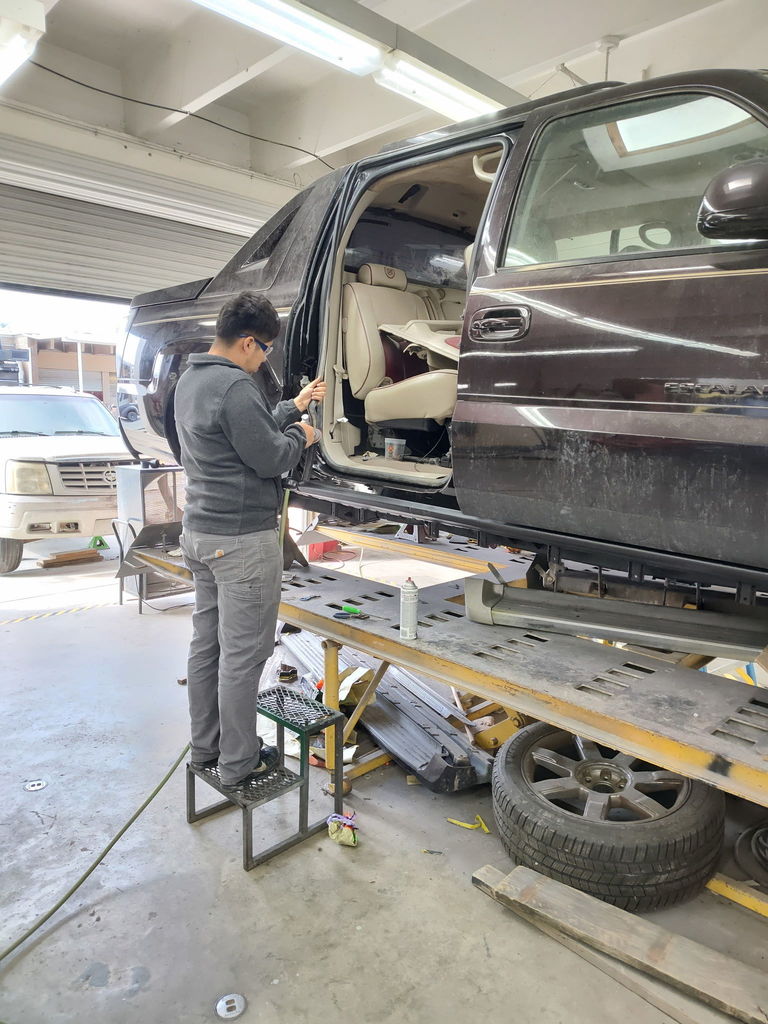 Student working on Cadillac EXT