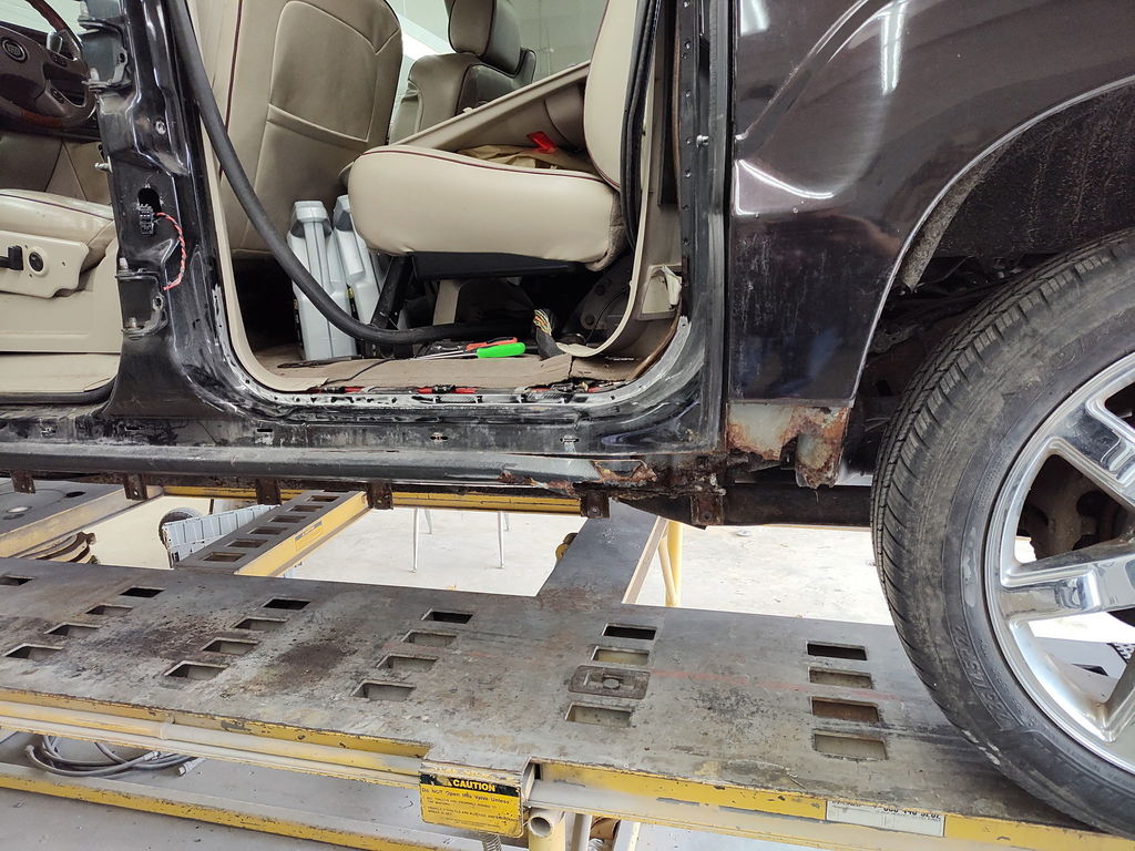 Rust repair on Cadillac - 2