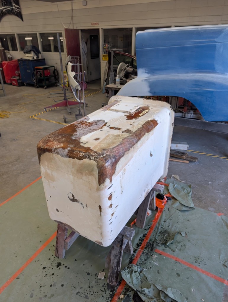 Fiberglass repair on a rusted out tub in auto collision - 1 