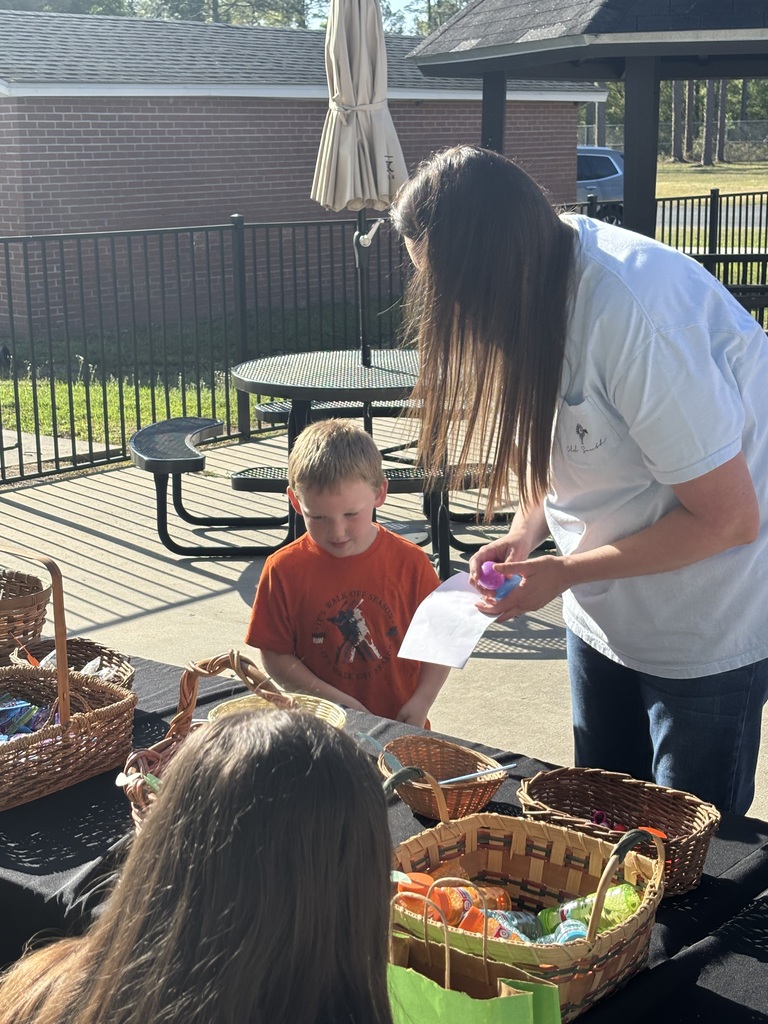Student looking at easter goodies on table