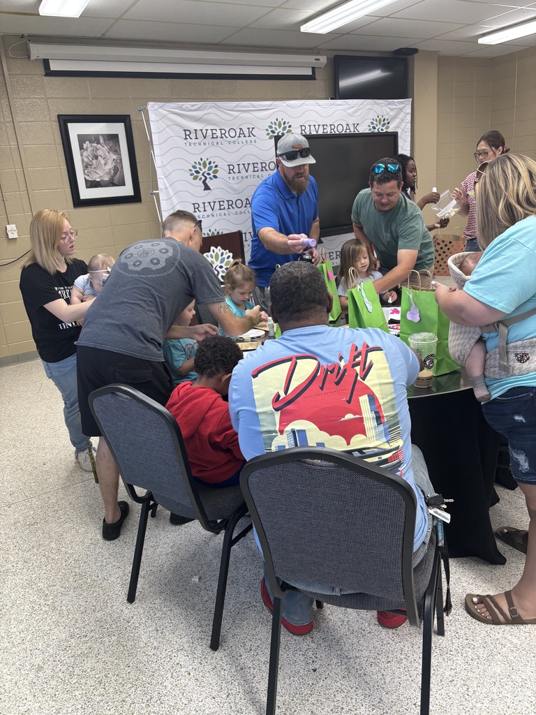Students inside sitting down at the table looking through easter eggs