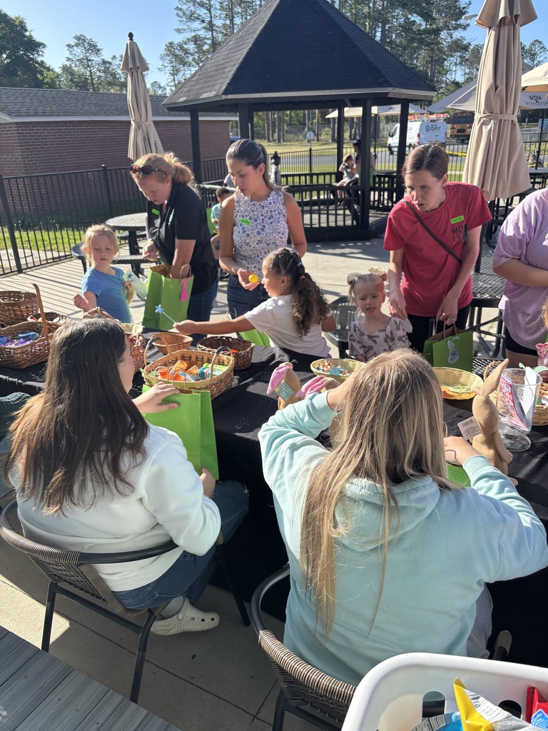 Students at table with easter eggs