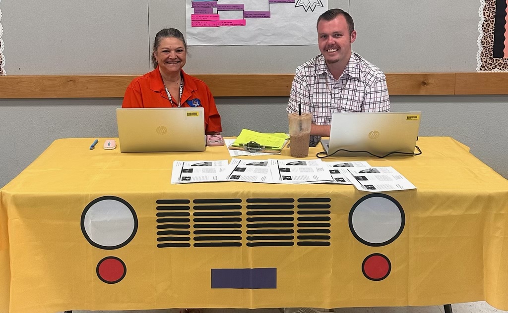 SCSD Transportation staff sitting at table smiling 