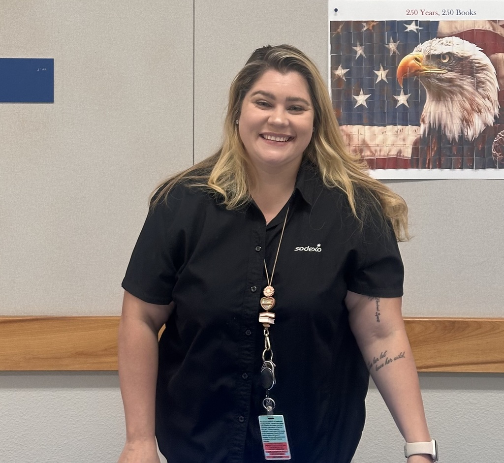 SCSD Sodexo employee smiling at table 