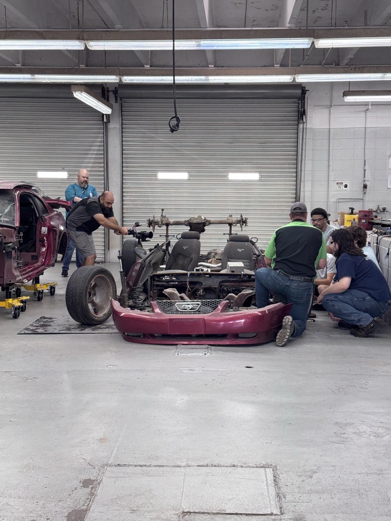 Cameraman in Automotive Shop