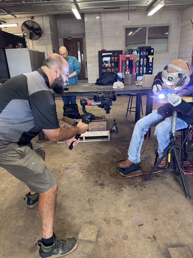 Cameraman in Welding Shop