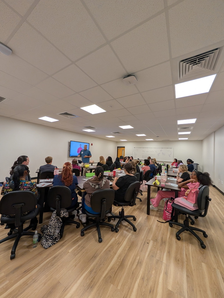 Students listening to the BLS trainer