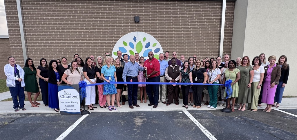 Group photo in front of RIVEROAK's new nursing facility 