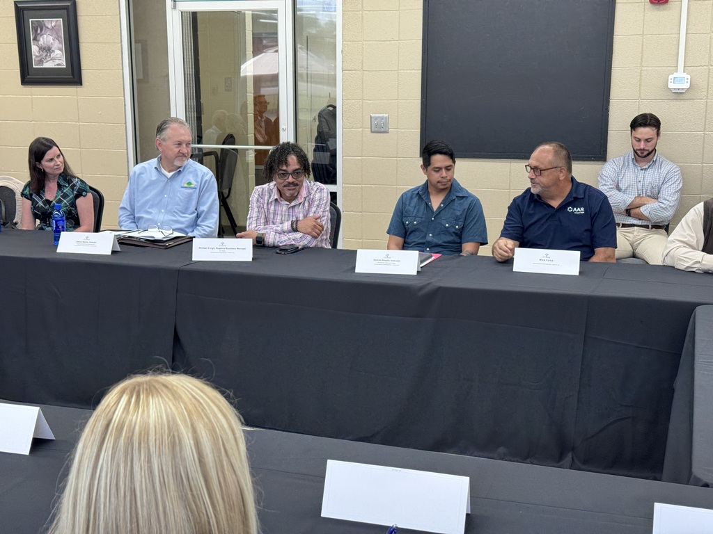 Male speaking during roundtable event 