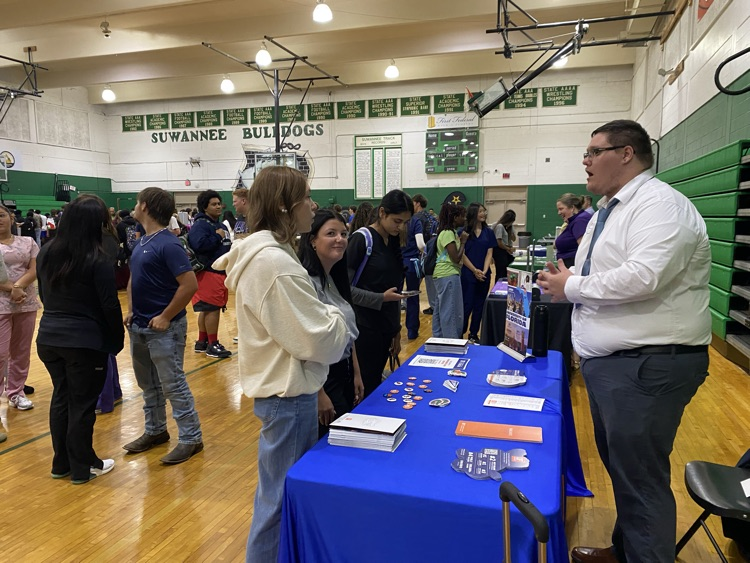 2026 College fair, students are visiting various informational booths about colleges around the southeast as well as representatives from military branches.