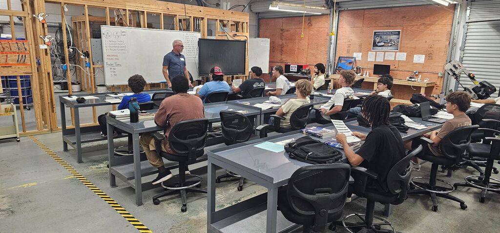 Students listening to a presentation in a classroom 
