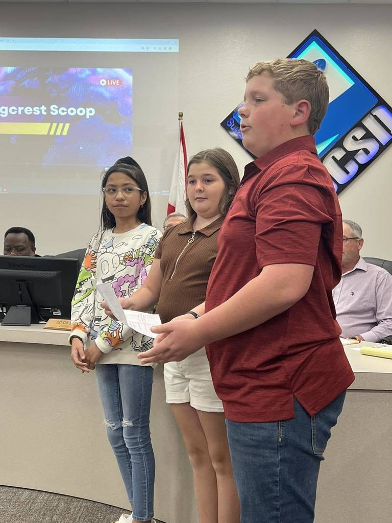 three students addressing the school board