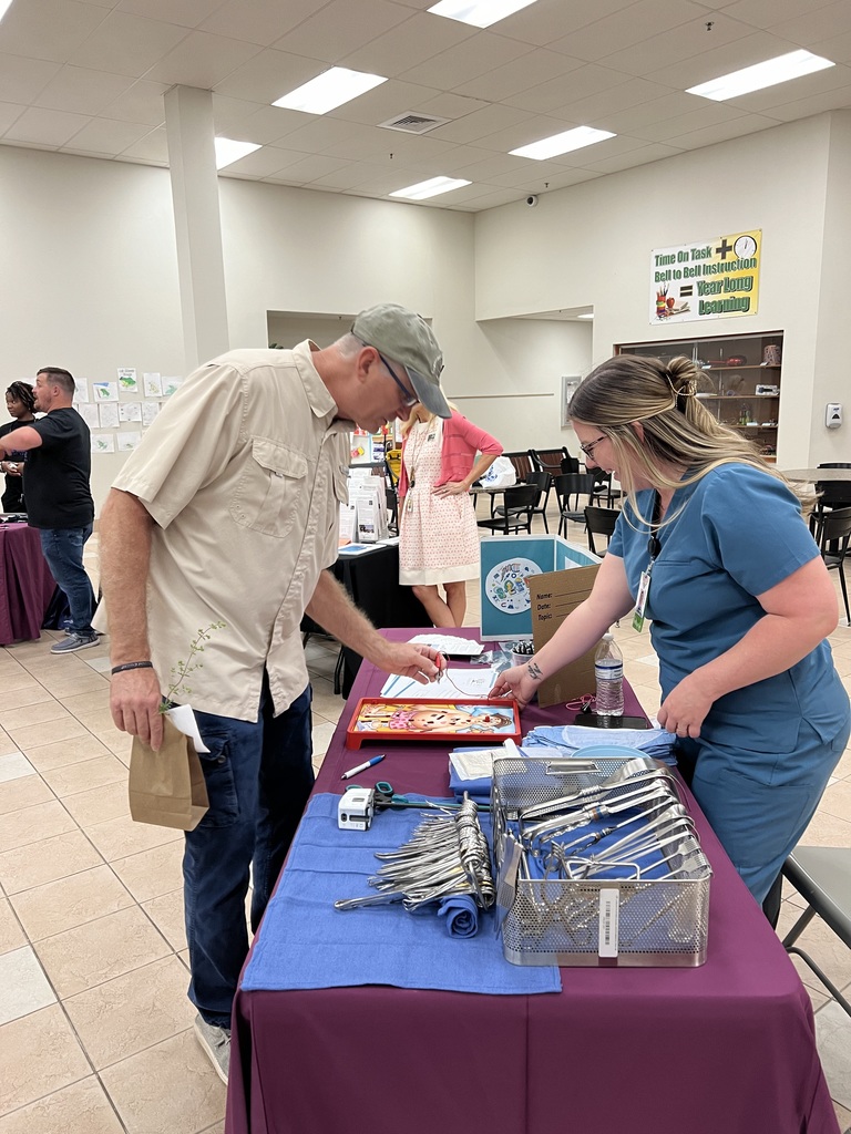Suwannee County School District Board Member Ed DaSilva takes a go at Operation at the Surgical Technology booth