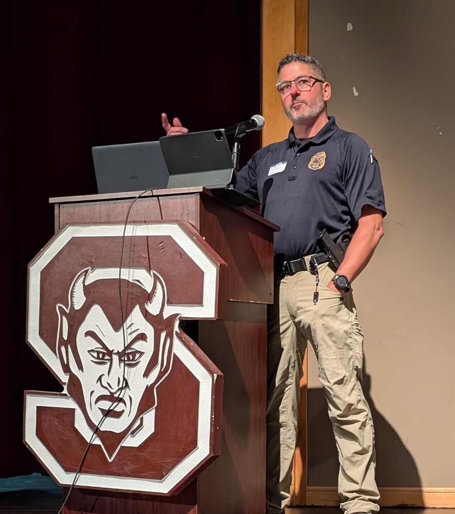 Mike McLeod addresses Swain County High School students on the character trait Repect