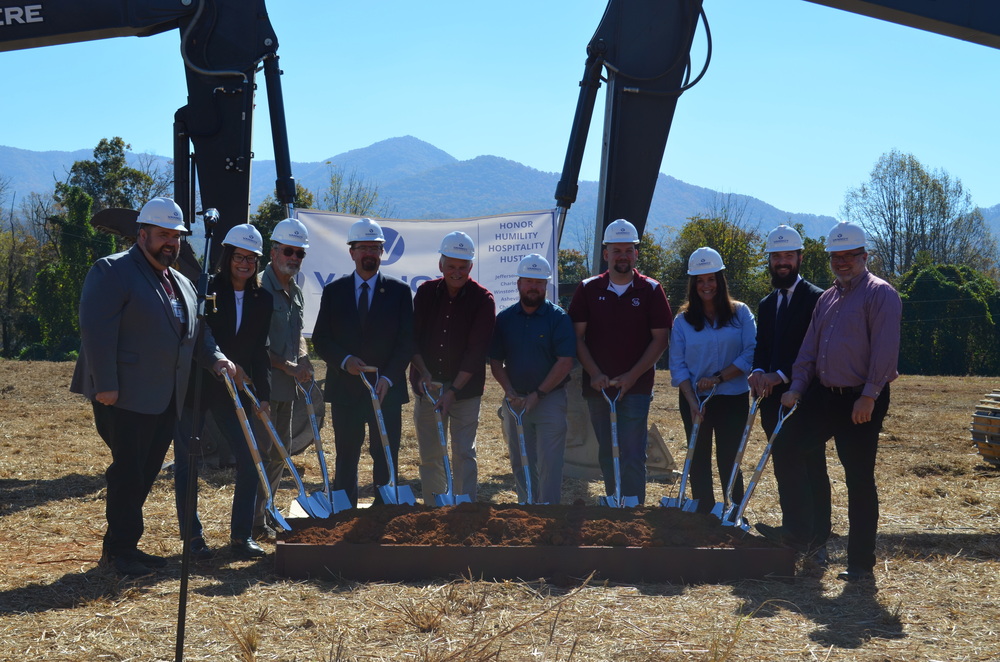Group of 10 people with shovels at groundbreaking