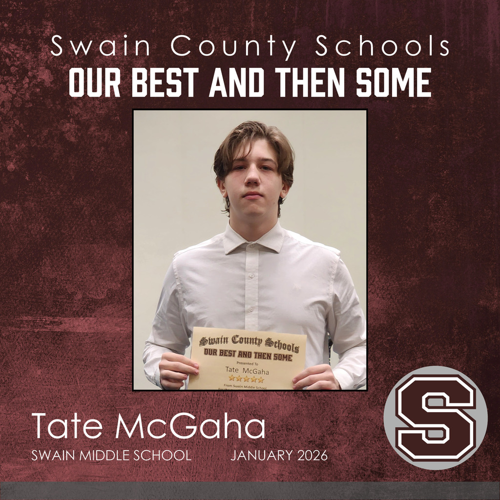 Middle school boy holding certificate