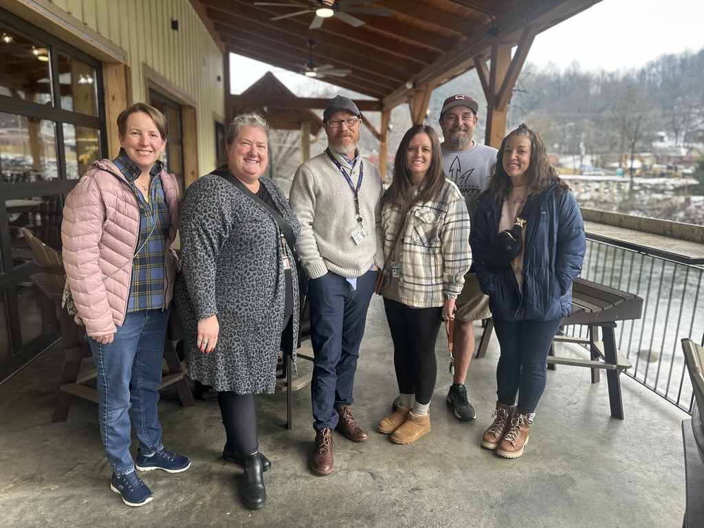 Photo featuring group of adults .