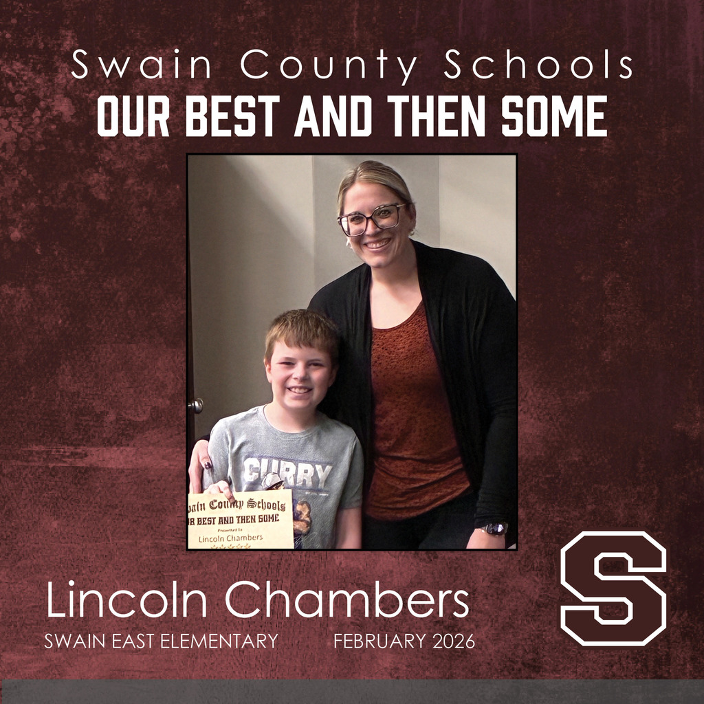 Lincoln Chambers: A young boy in a grey t-shirt smiles while holding his award certificate. Standing beside him is a smiling woman with blonde hair and glasses wearing a dark cardigan over a rust-colored top.
