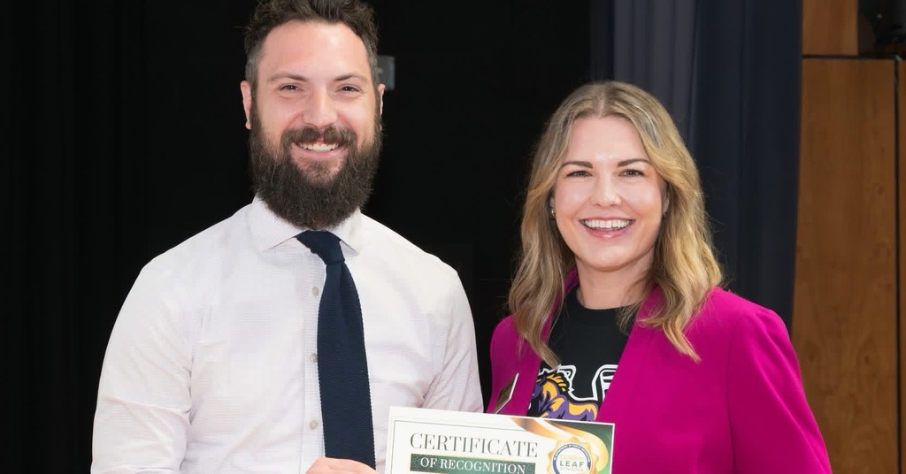 Man and woman with certificate