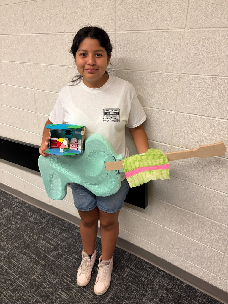 Female student holding guitar