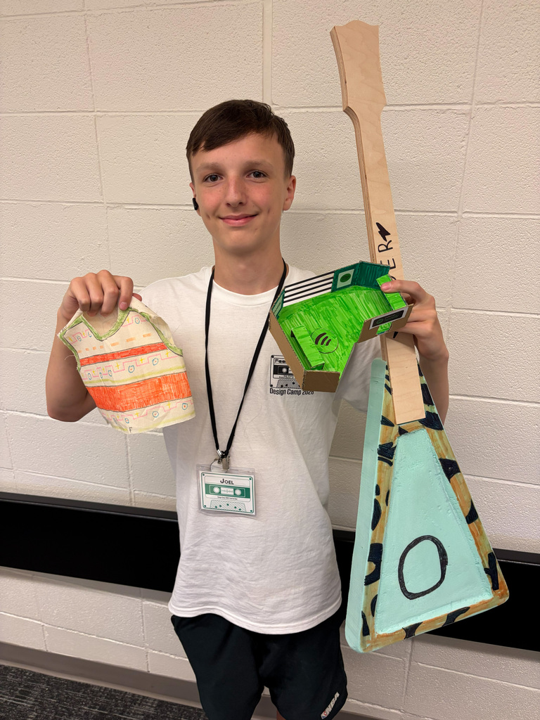 Male student holding guitar
