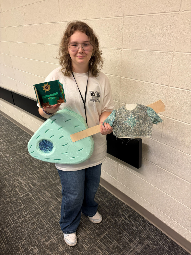 Female student holding guitar