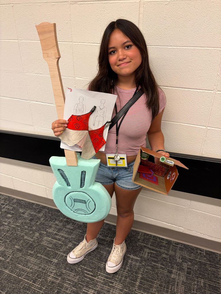 Female student holding guitar