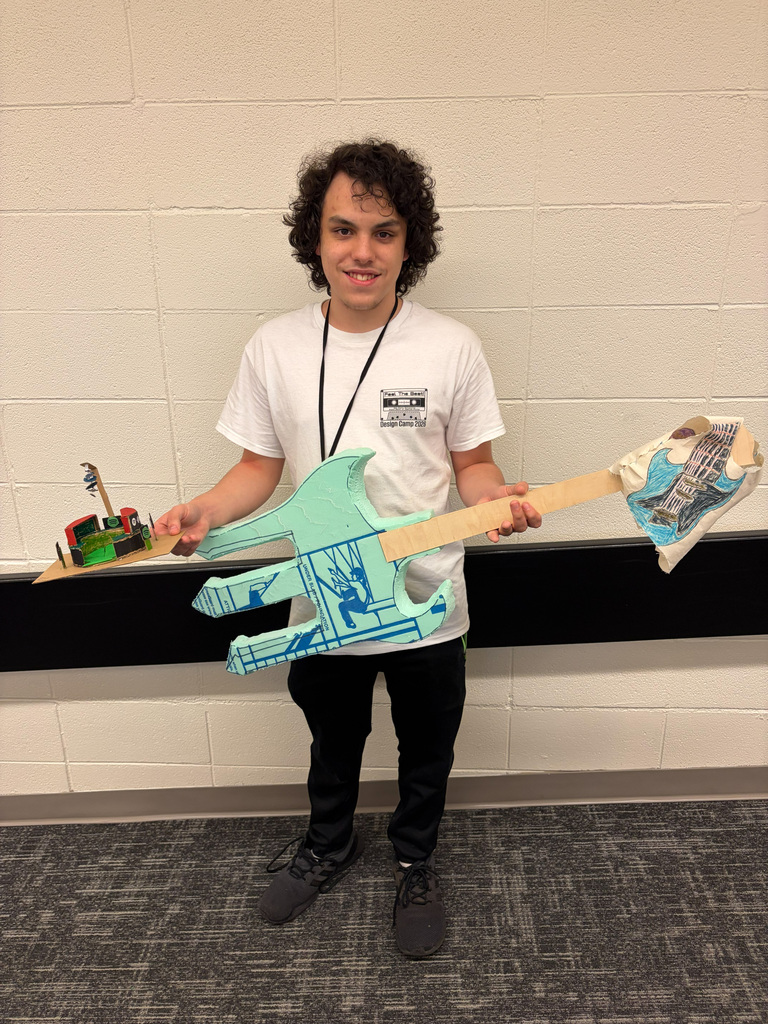 Male student holding guitar