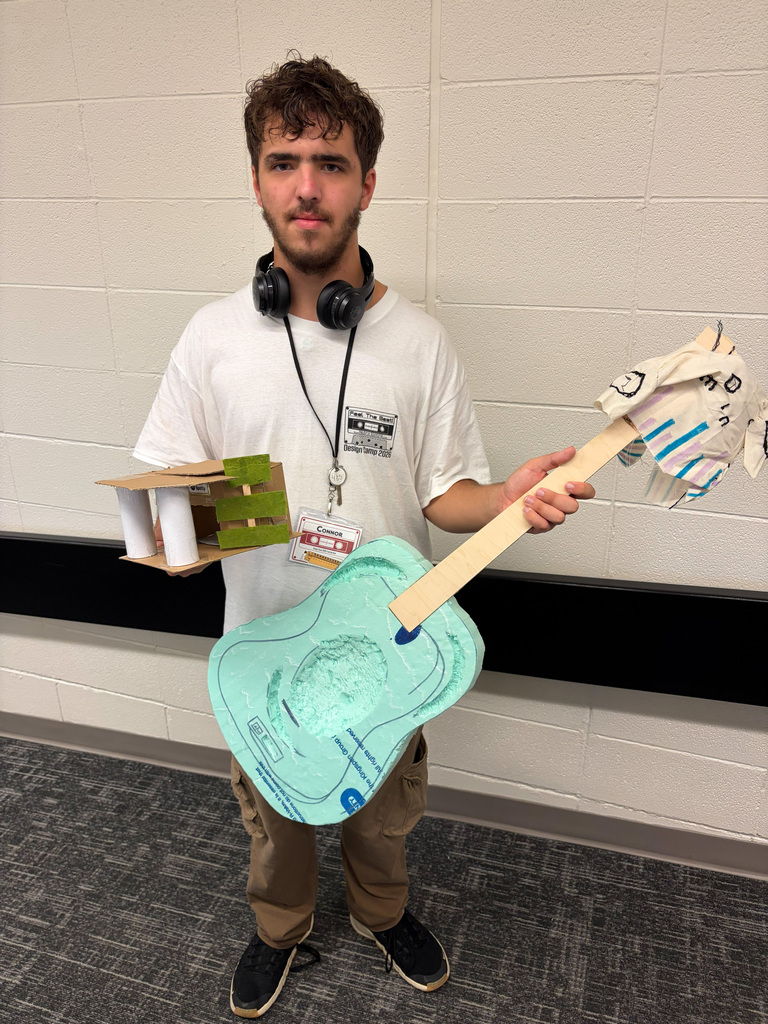 Male student holding guitar