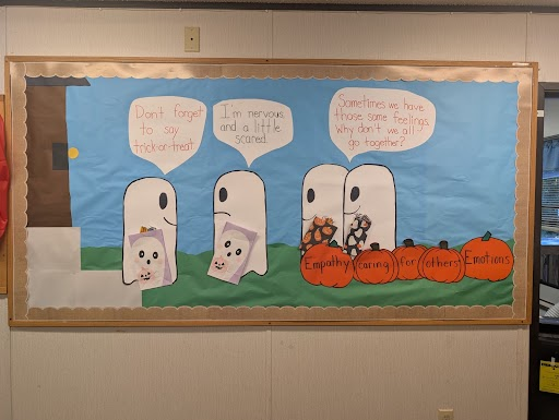 Halloween scene where ghosts are showing empathy for each other.
