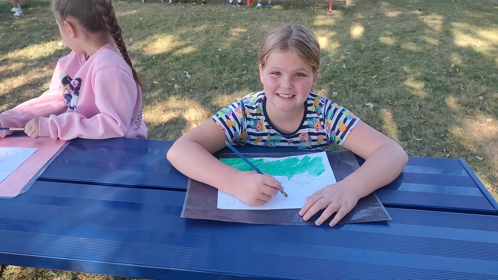 student drawing outside