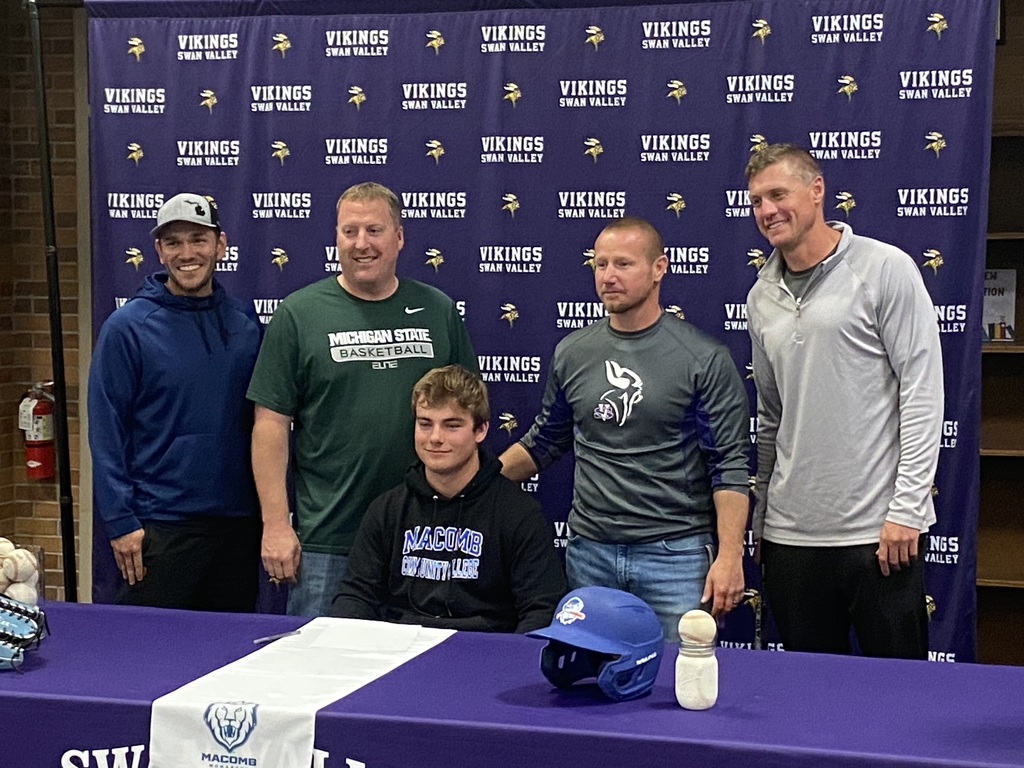 Colton Klein and Varsity Football Coaching Staff