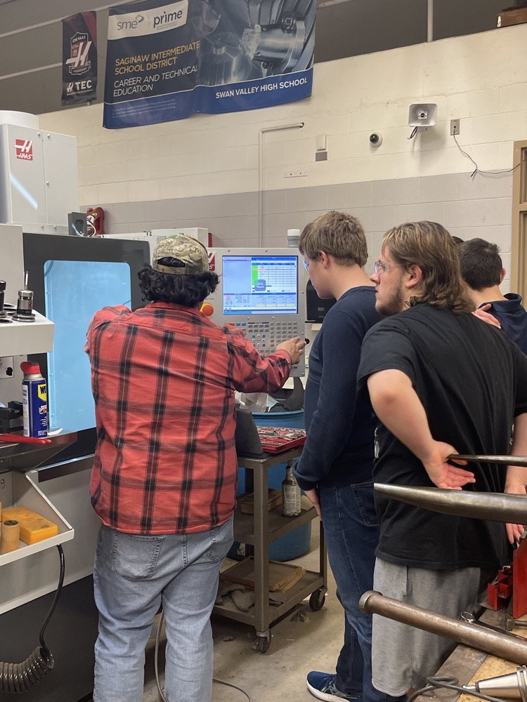 students learning CNC machining