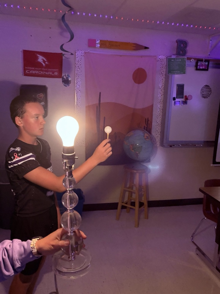 8th students having fun with the Moon Phases in Mrs. Blaesser's class.