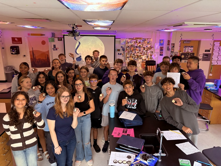 8th students having fun with the Oreo Eclipse project in Mrs. Blaesser's class.