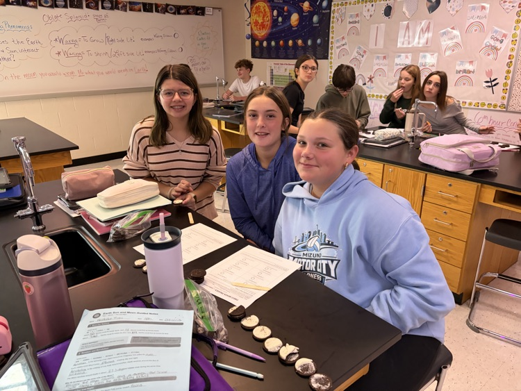 8th students having fun with the Oreo Eclipse project in Mrs. Blaesser's class.